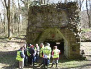 Group of people surveying a structure